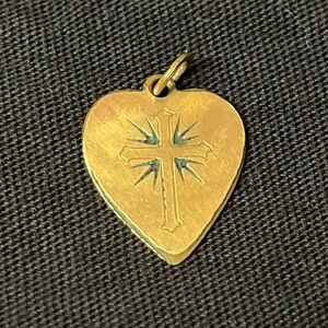 Vintage Gold Heart Pendant with Cross and Starburst Design